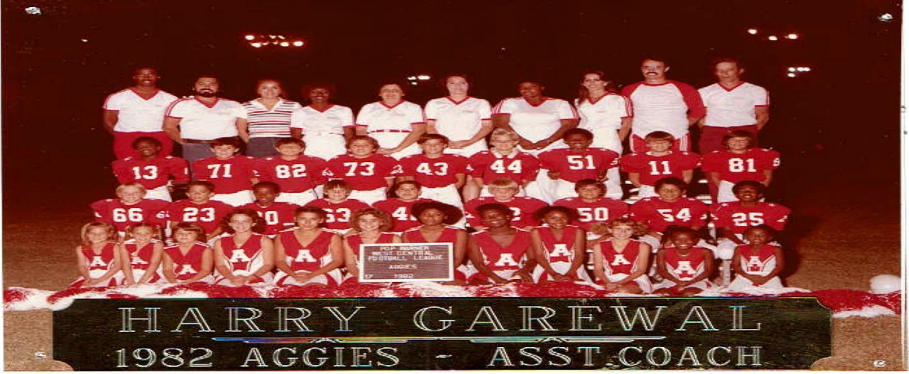 1982 Isaac Aggies Pop Warner youth football team with the engraved placard identifying Harry Garewal as assistant coach